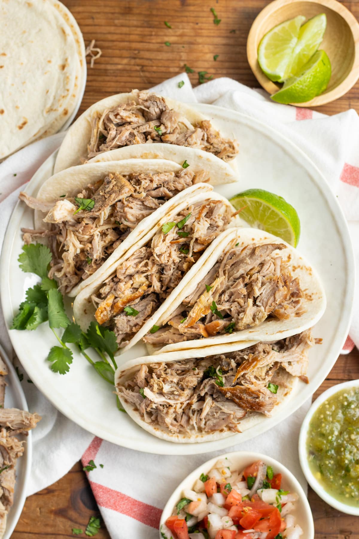 This is a picture of a plate of tacos with slow-cooker pork carnitas.