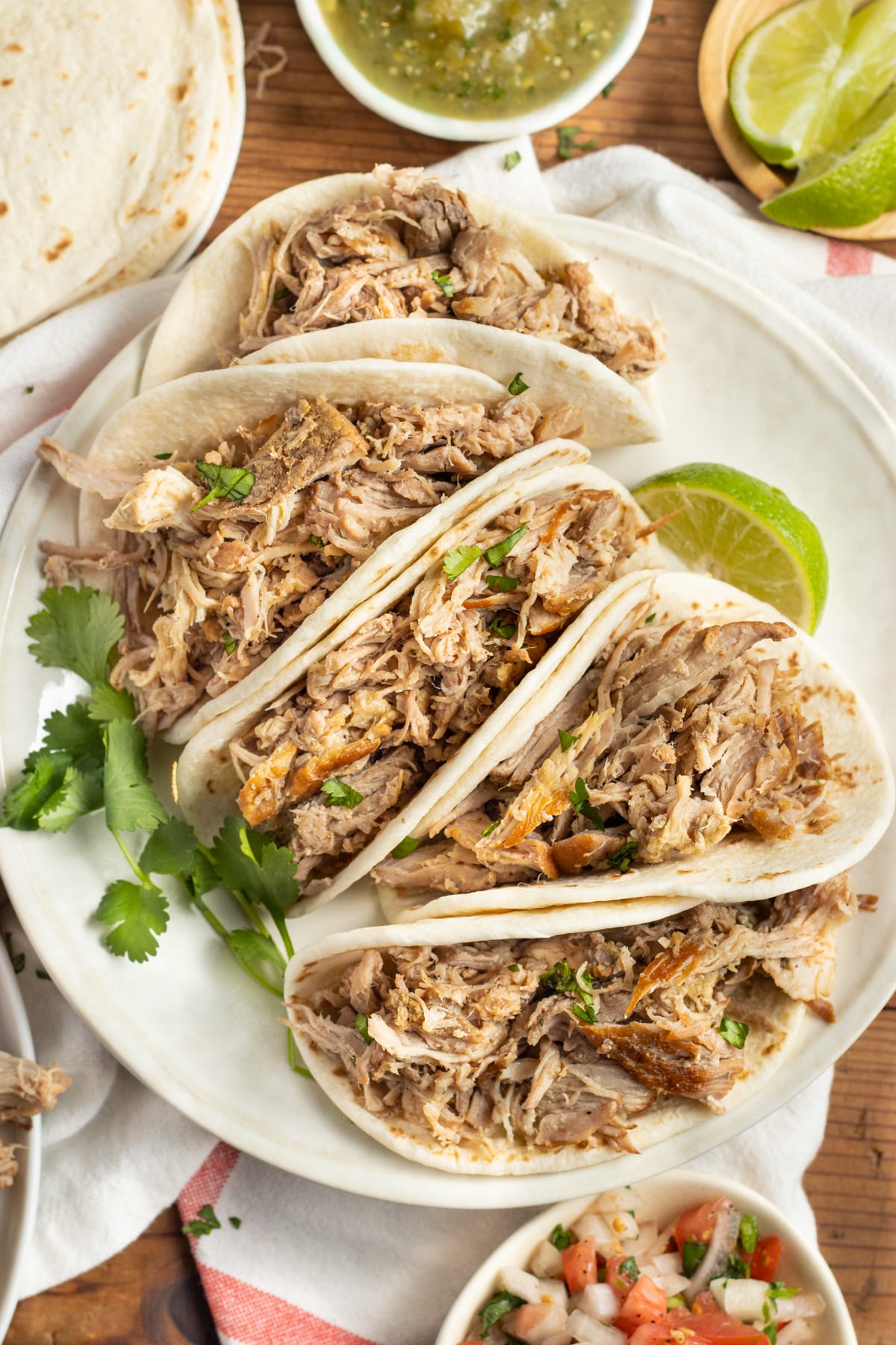 This is a picture of a plate of tacos with slow-cooker pork carnitas.