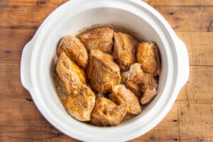 This is a picture of the pork added to the crockpot before cooking.