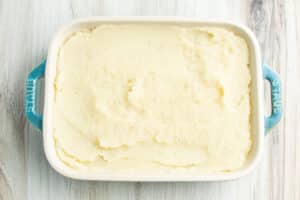 Second layer of mashed potatoes mixed with mashed cauliflower.