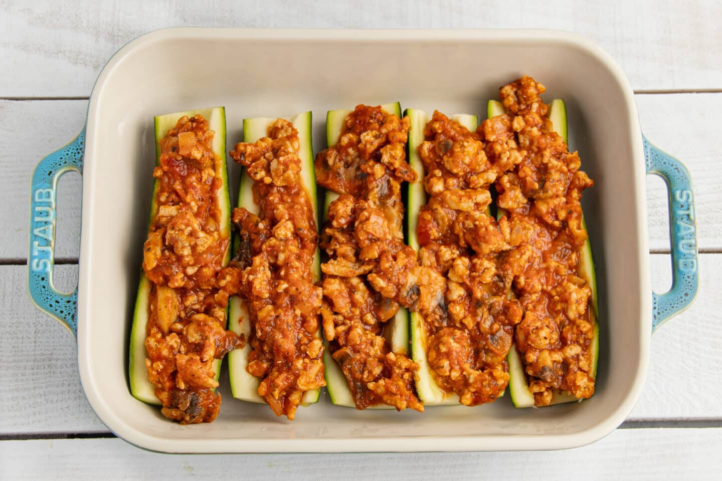 Picture of zucchini boats filled with chicken mixture.