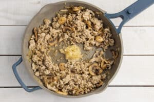 Picture of skillet with minced garlic added.