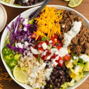 This is a square picture of a beef taco bowl.