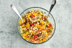 Photo of bowl with all ingredients from mango salsa.