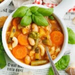 Picture of a white bowl with soupe au pistou.