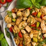 This is a picture of a plate of chicken tortellini caprese salad.