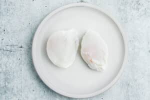 This is a picture of two poached eggs on a plate.