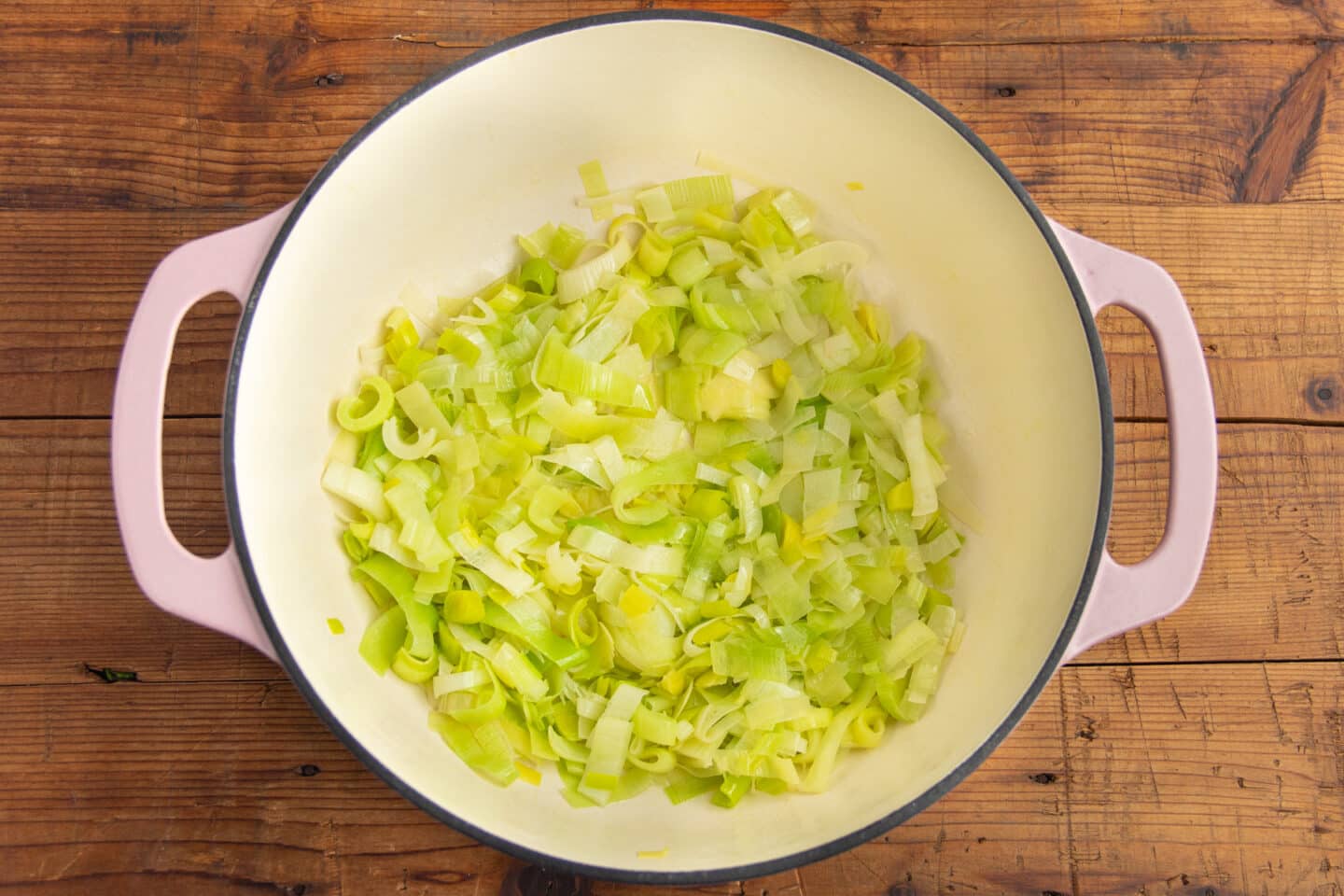 This is a picture of a big pot with leeks cooking.