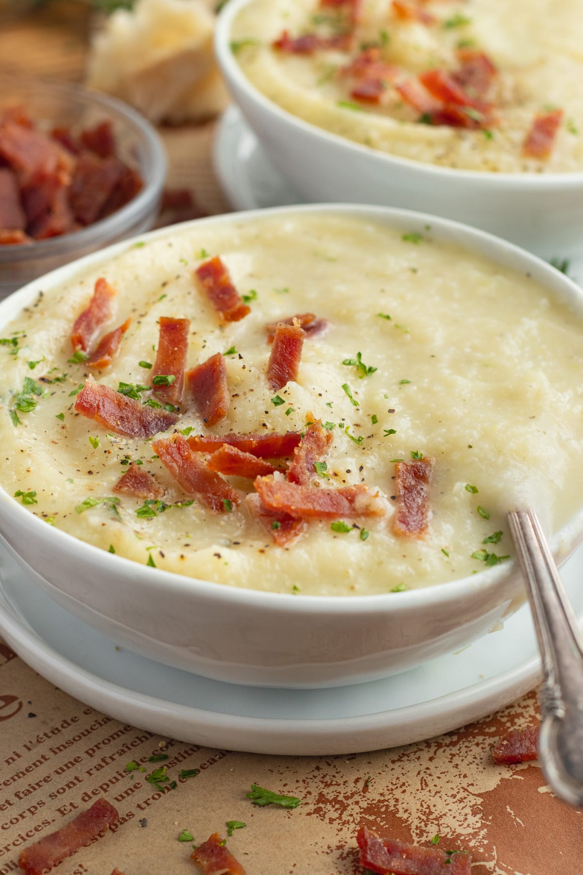 This is a picture of a bowl filled with potato cauliflower leek soup.