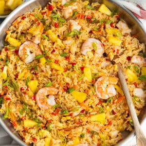 Picture of skillet filled with shrimp and pineapple fried rice.