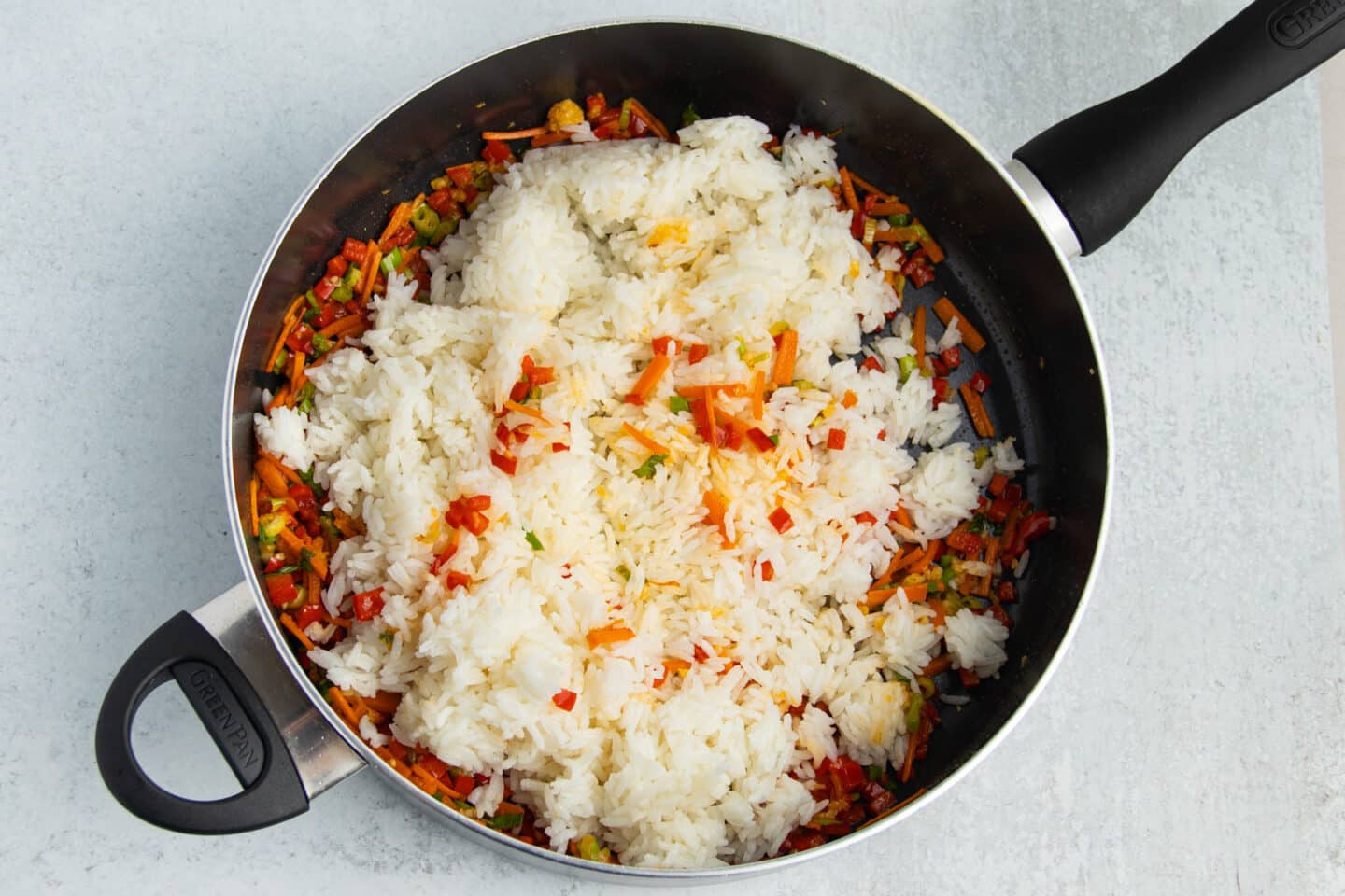Picture of fried rice with cooked rice added.