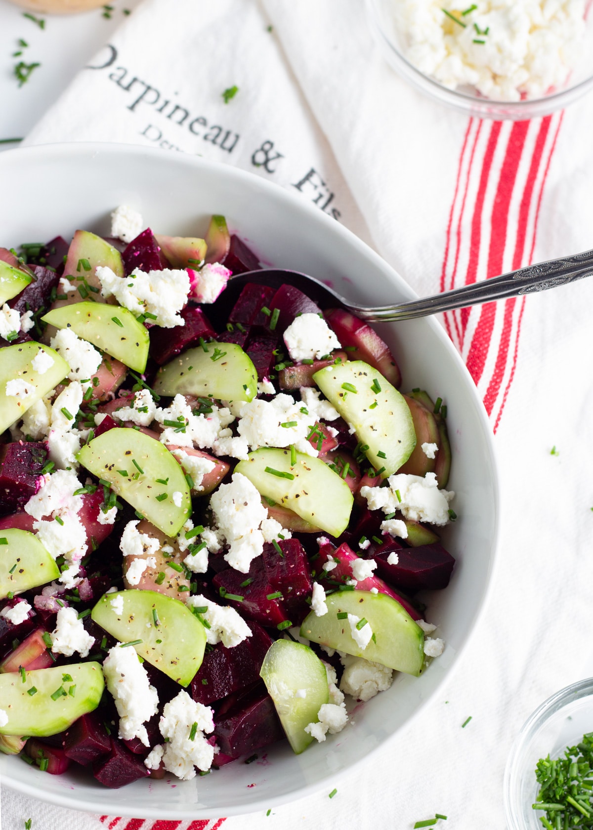 picture of a large bowl with beet cucumber goat cheese salad.