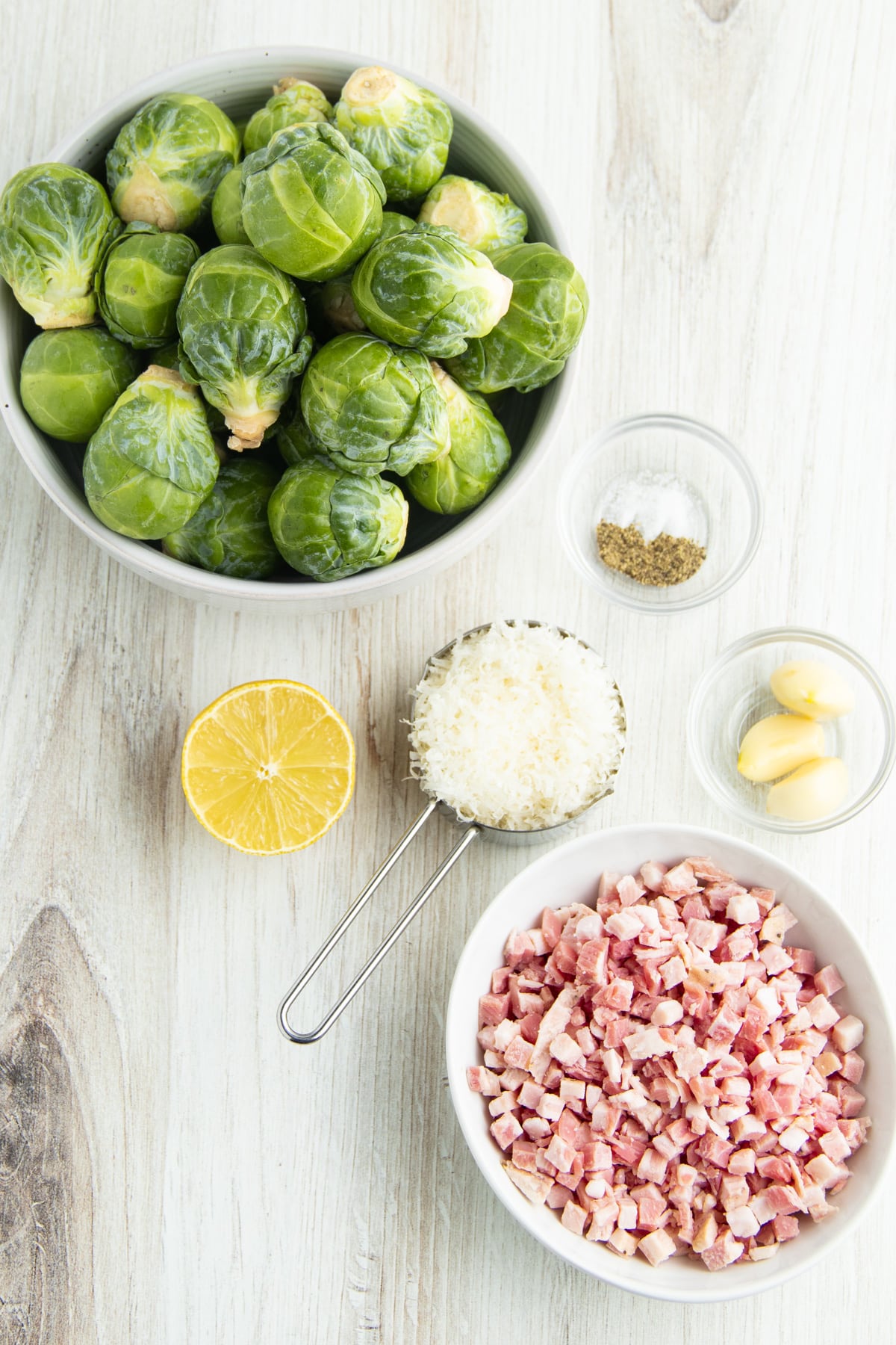 Picture of individual ingredients to make Brussels sprouts with pancetta and parmesan. 