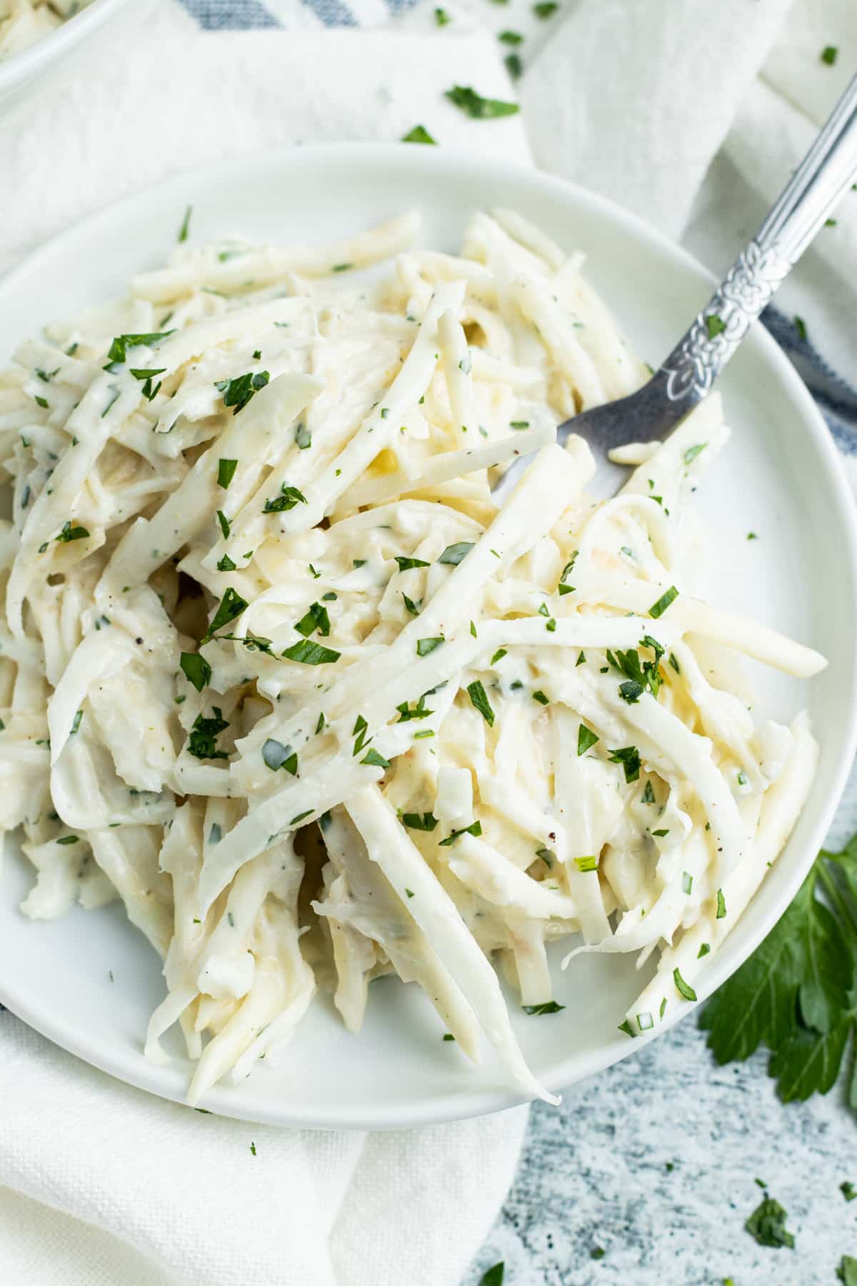 Plate of celery remoulade with a fork. 