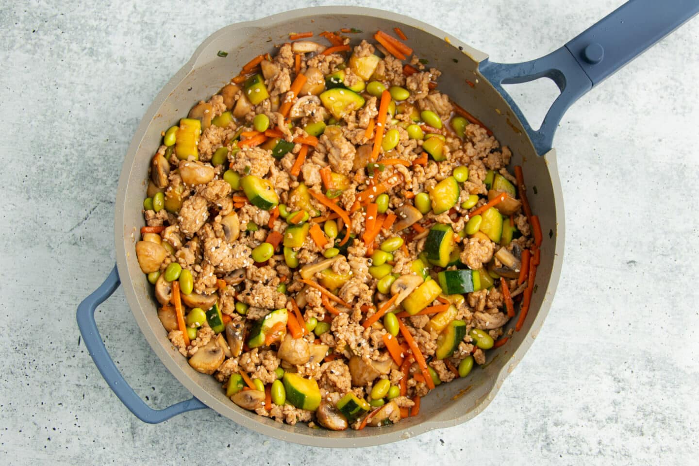Picture of stir fry in skillet with sauce in it.