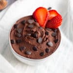 Picture of dark chocolate hummus in bowl with strawberries.