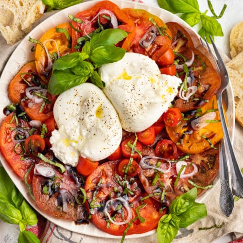 Picture of large plate with burrata salad.