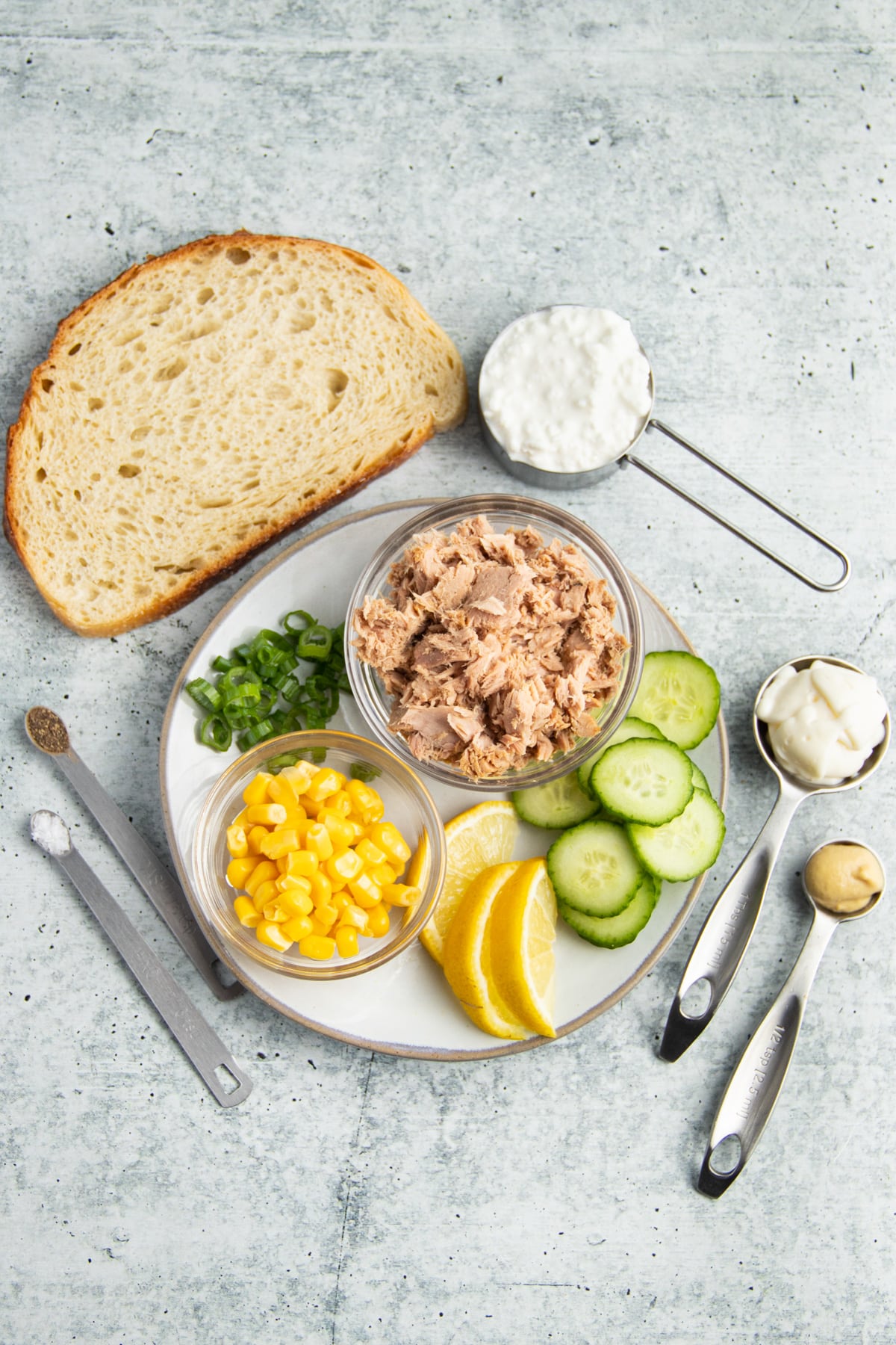 Picture of all ingredients for tuna and corn salad with cucumber cottage cheese toast. 
