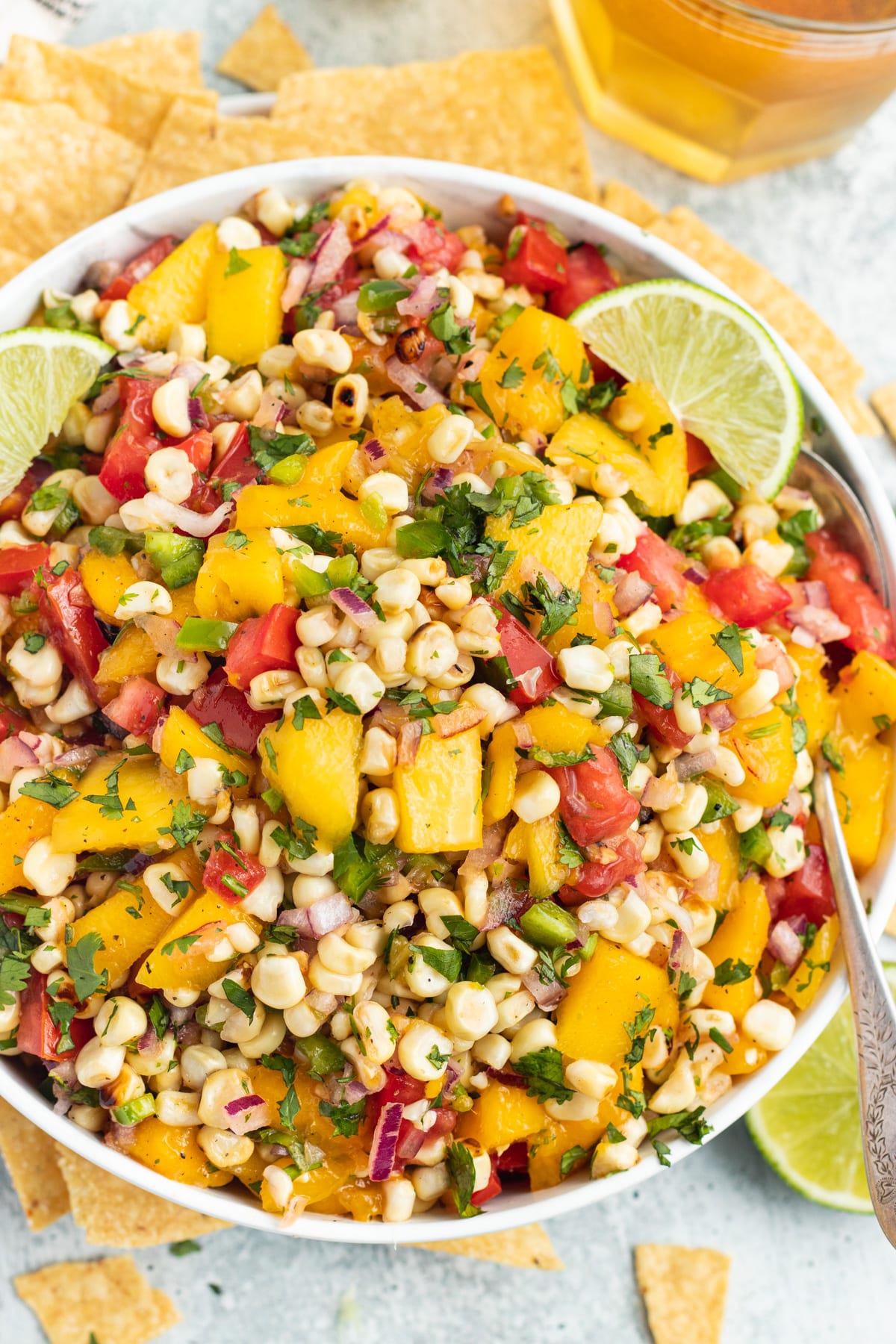 Picture of a bowl filled with mango and grilled corn salsa.