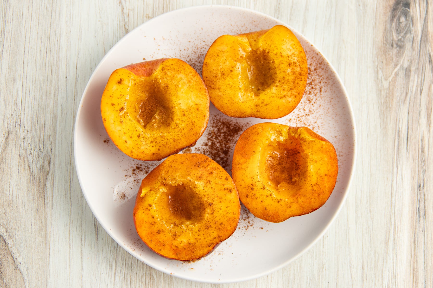 https://sprinkledwithbalance.com/wp-content/uploads/2023/06/air-fryer-peaches-2.jpg