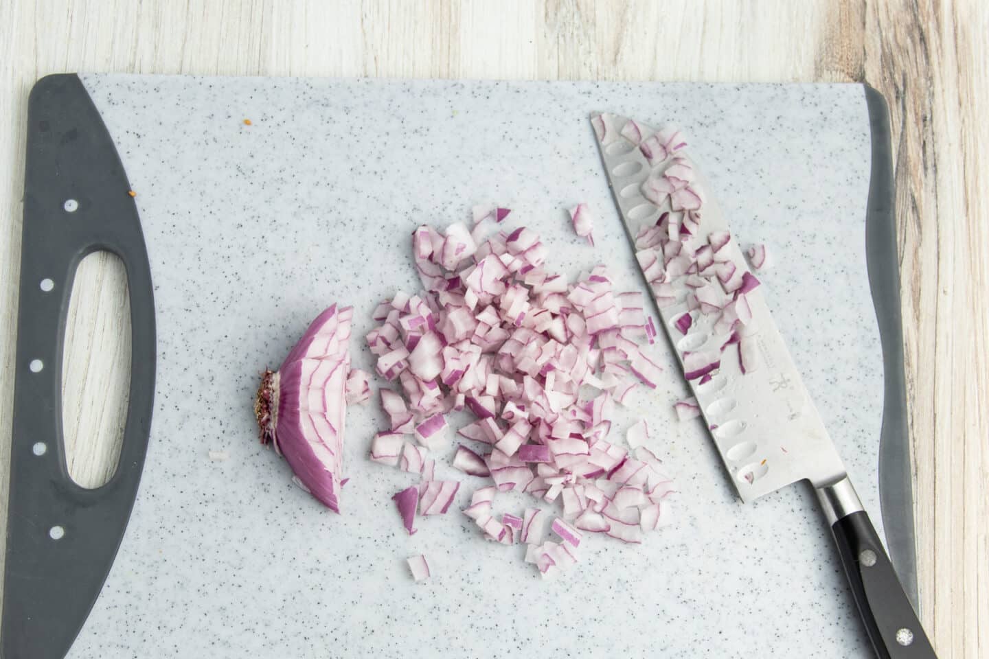 Picture of red onion being diced.