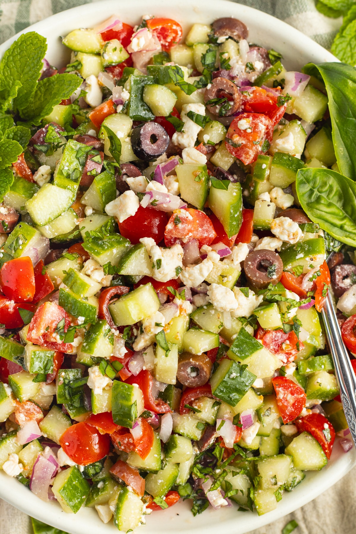 Picture of Mediterranean cucumber salad in a white bowl.