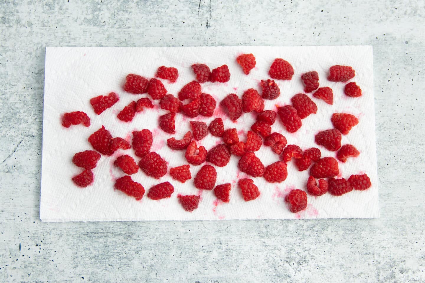 Picture of chopped raspberries on a paper towel.