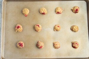 Picture of baking sheet filled with cookie dough balls.