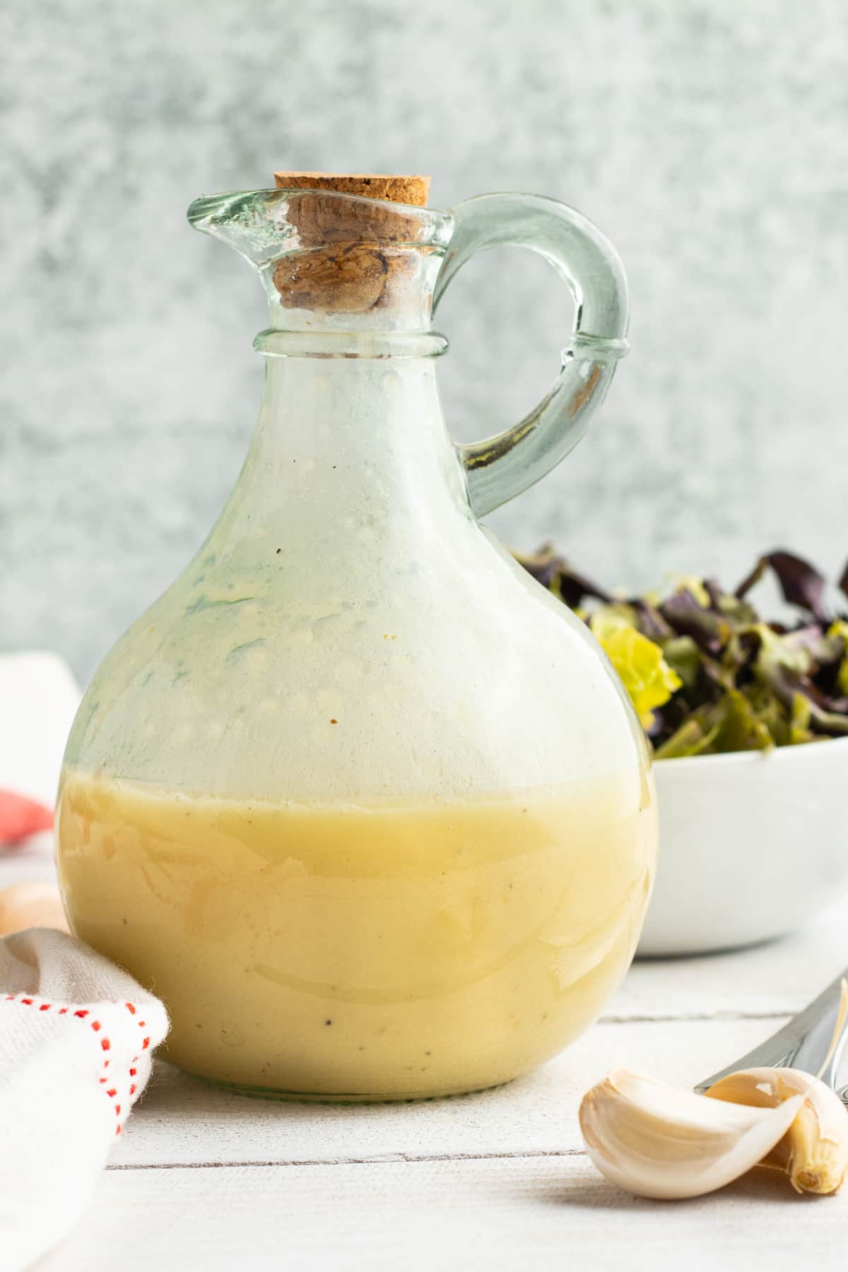 Picture of a jar filled with champagne vinaigrette.