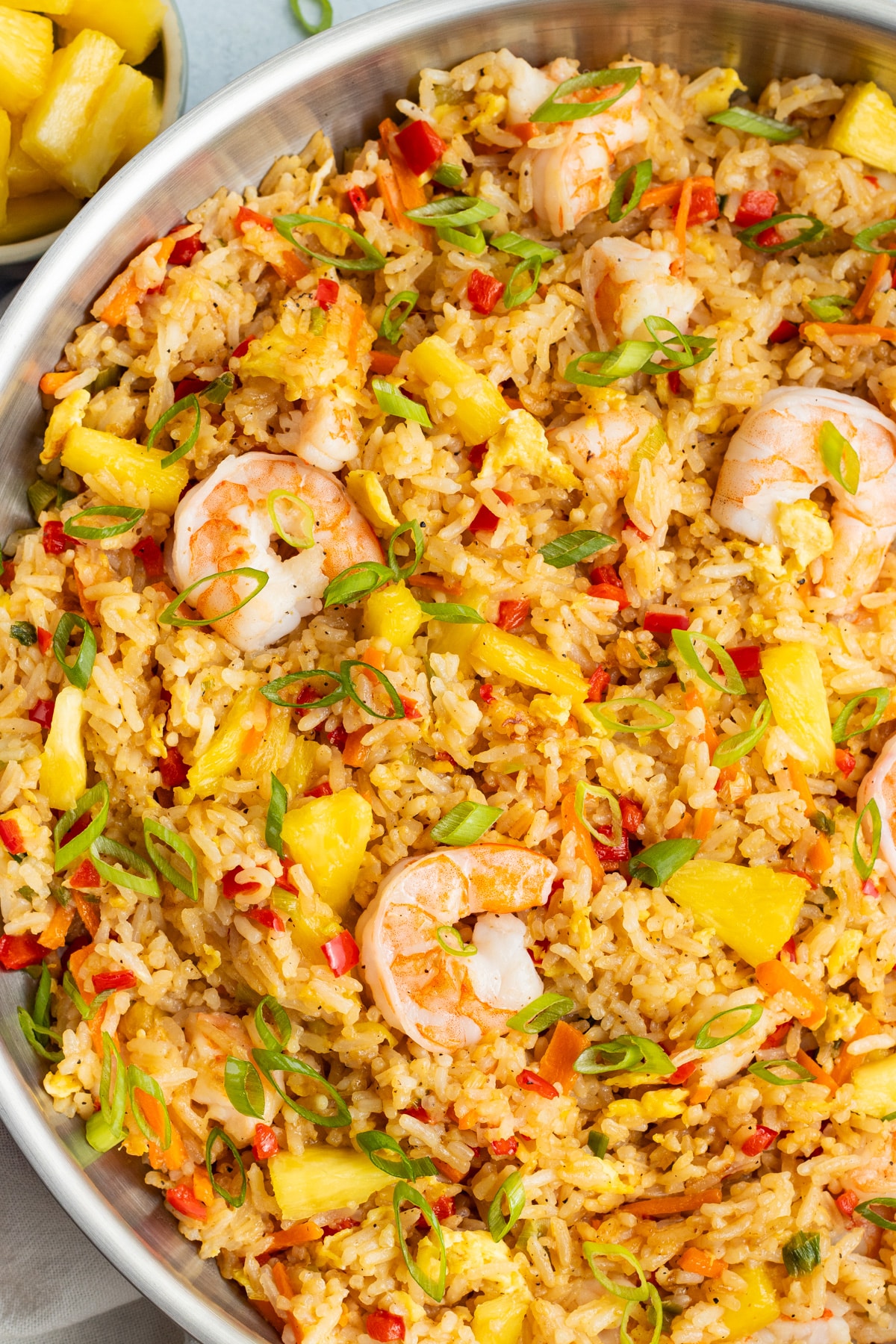 Picture of large skillet filled with shrimp and pineapple fried rice.