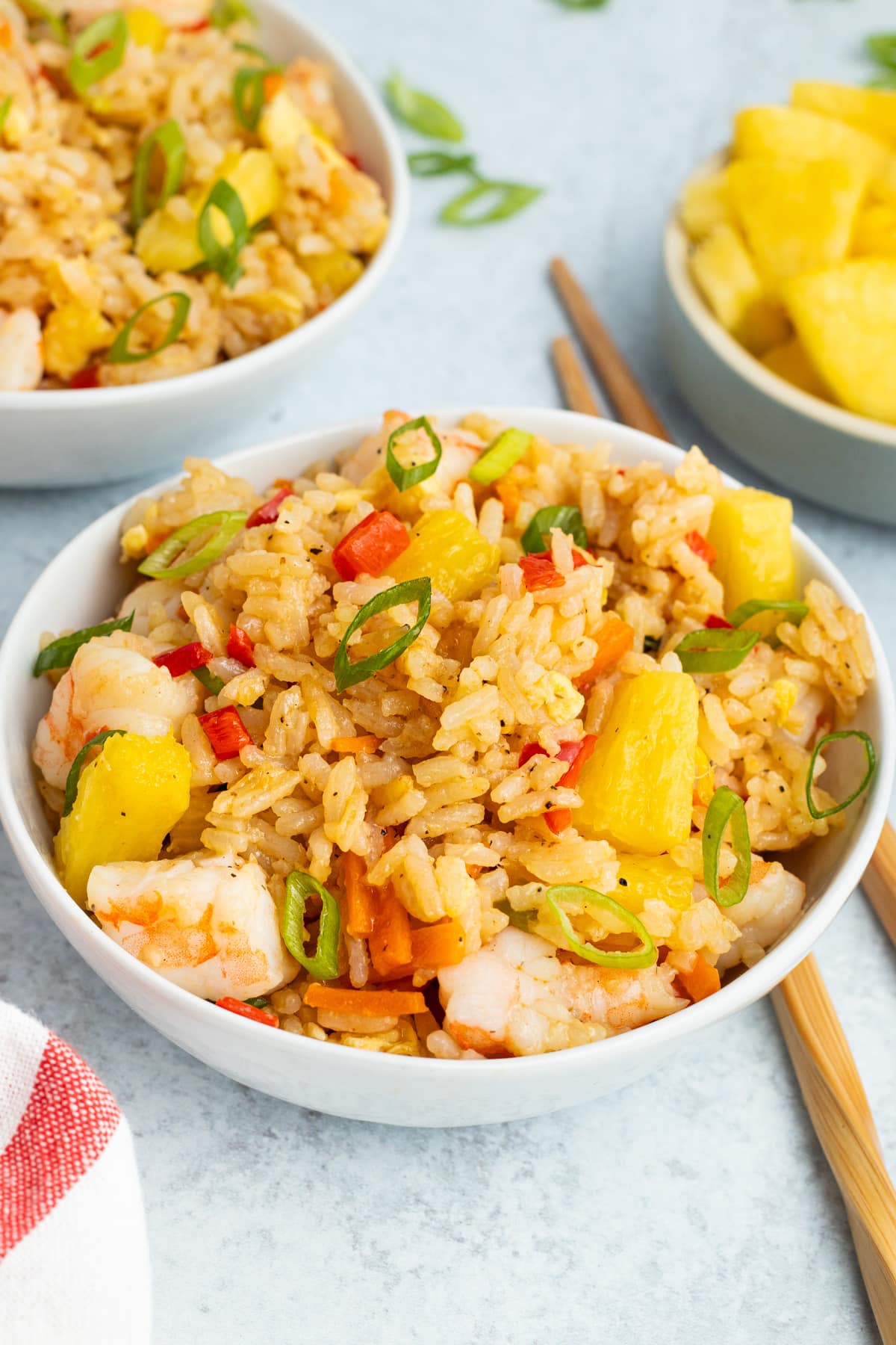 Picture of close-up fried rice in a small white bowl. 