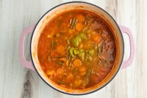 Picture of pot of soup with pistou added.