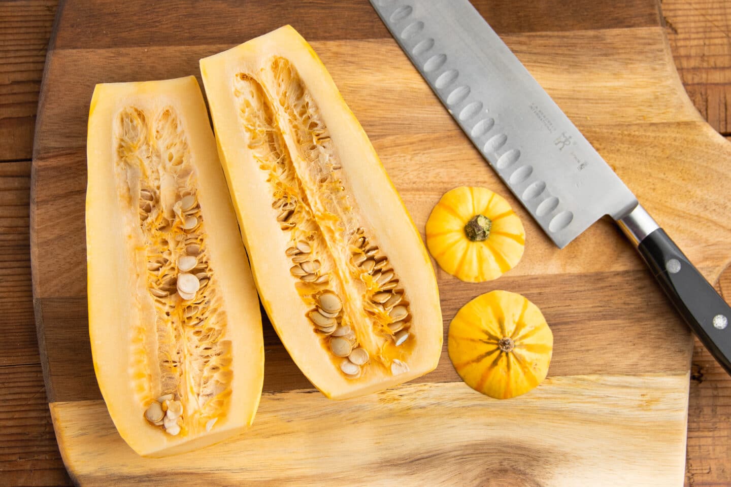 This is a picture of cutting delicata squash in half.