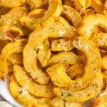 This is a square picture of air fried delicata squash.