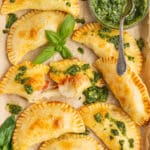 This is a square picture of caprese empanadas.