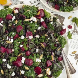 This is a square picture of kale with beets salad.