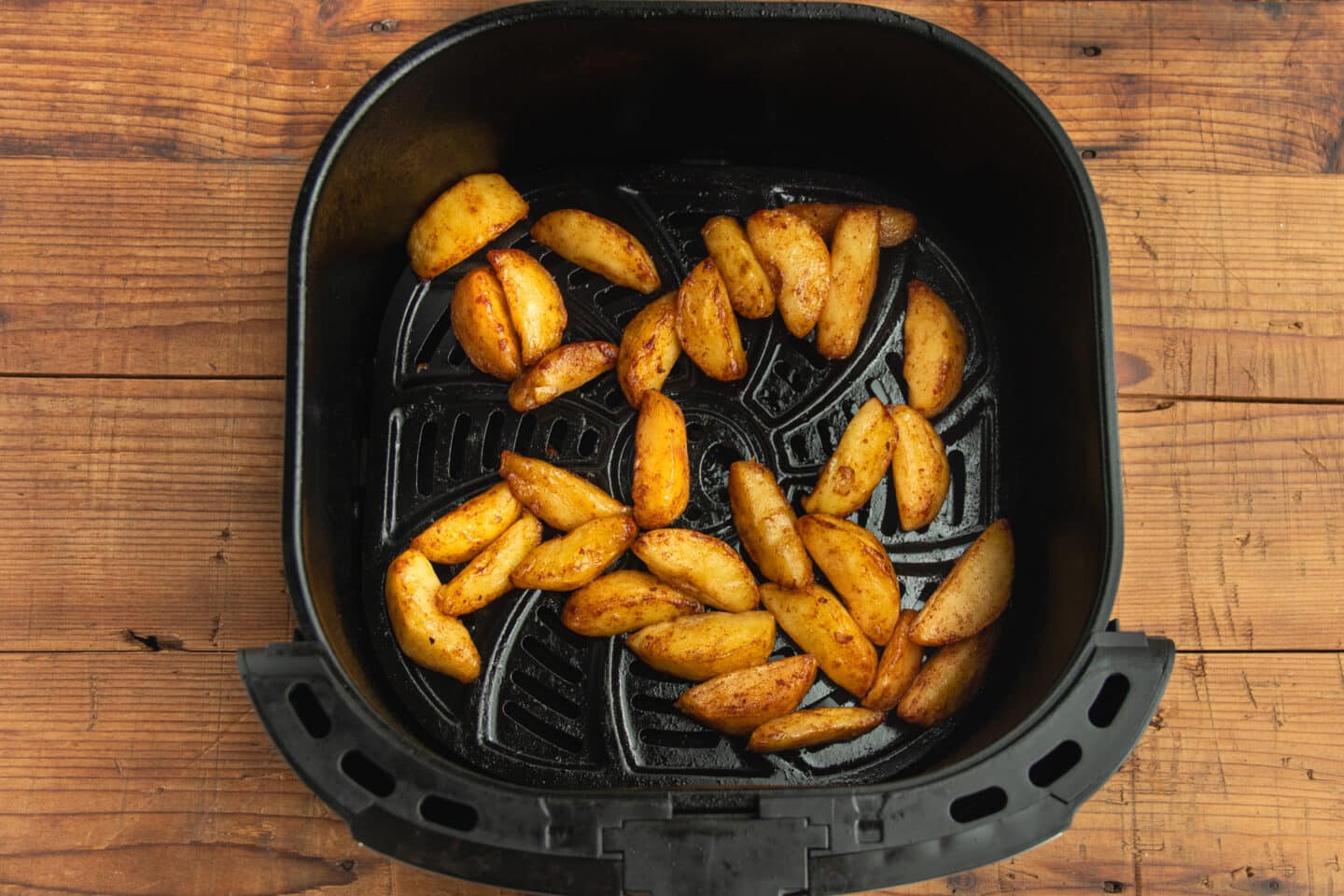 This is a picture of the air fryer basket with the cooked apples.