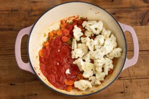 This is a picture of the pot with crushed tomatoes and cauliflower added.