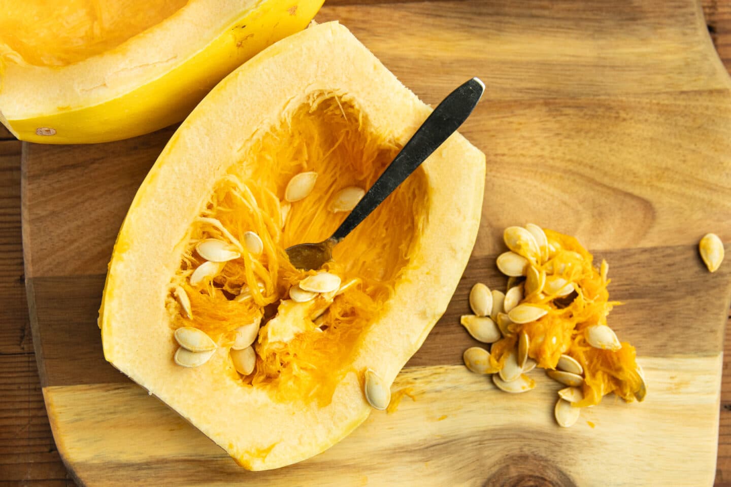 This is a picture of the seeds being removed from the inside of the squash.
