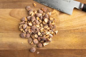 This is a picture of honey roasted almonds roughly chopped.