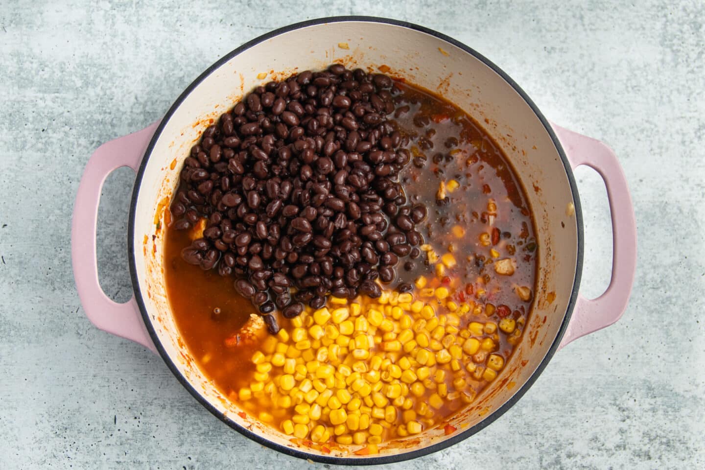 This is a picture of the pot with the the broth, black beans and corn added.