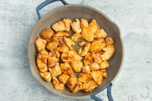 This is a picture of chicken being cooked in a skillet.