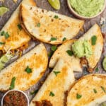 This is a square picture of baked bean and cheese tacos.