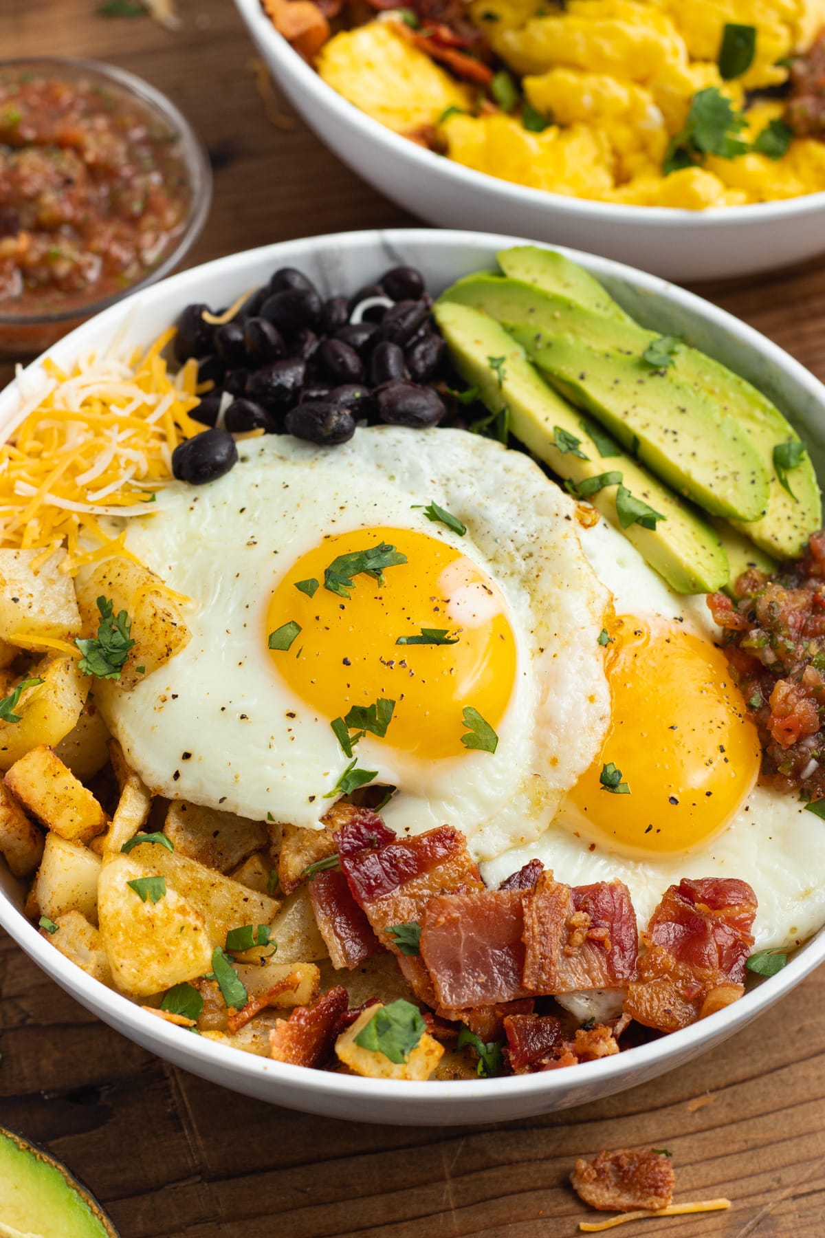 This is a picture of a breakfast bowl with fried eggs.