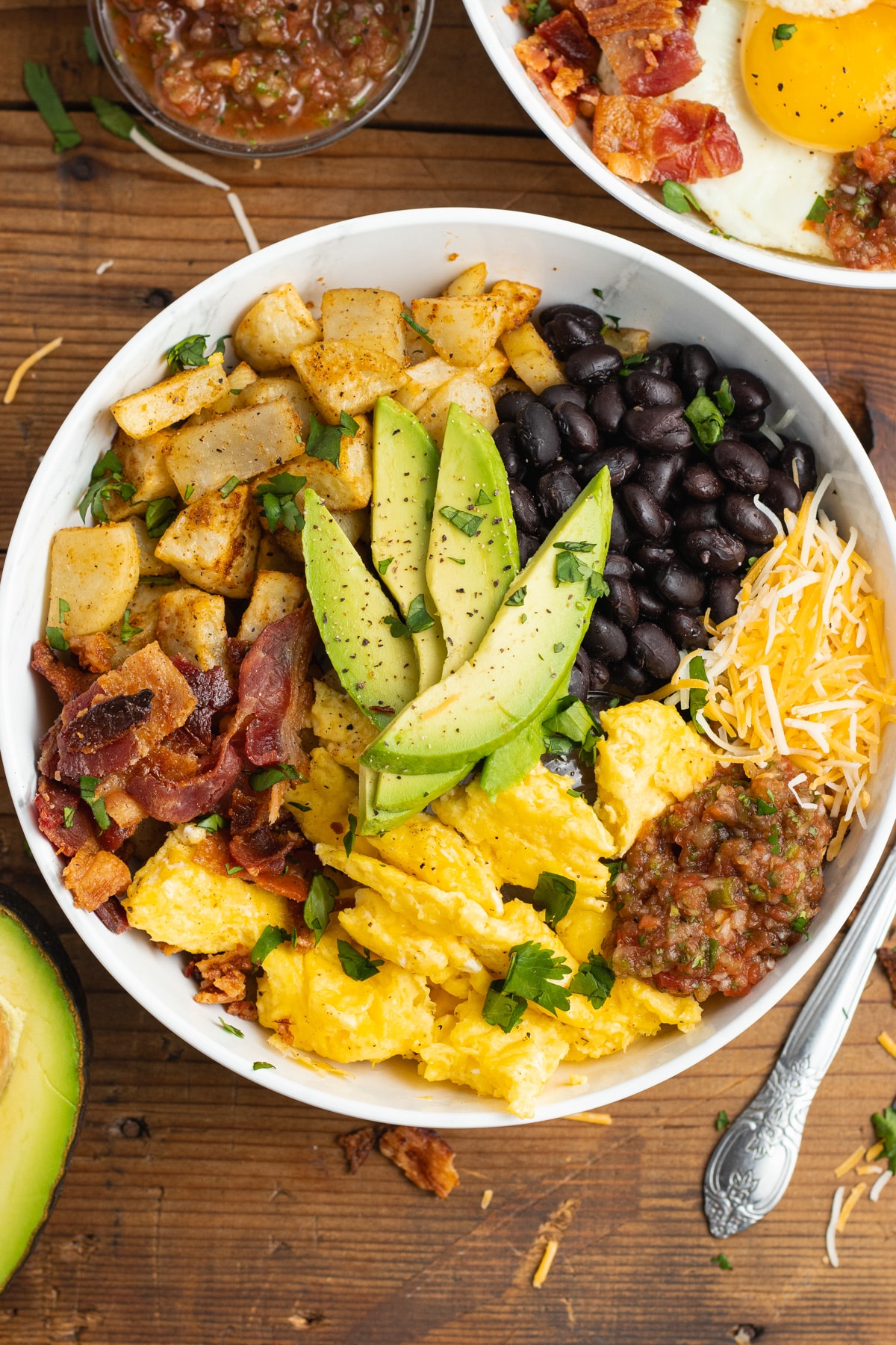 This is a picture of a breakfast burrito bowl with scrambled eggs.