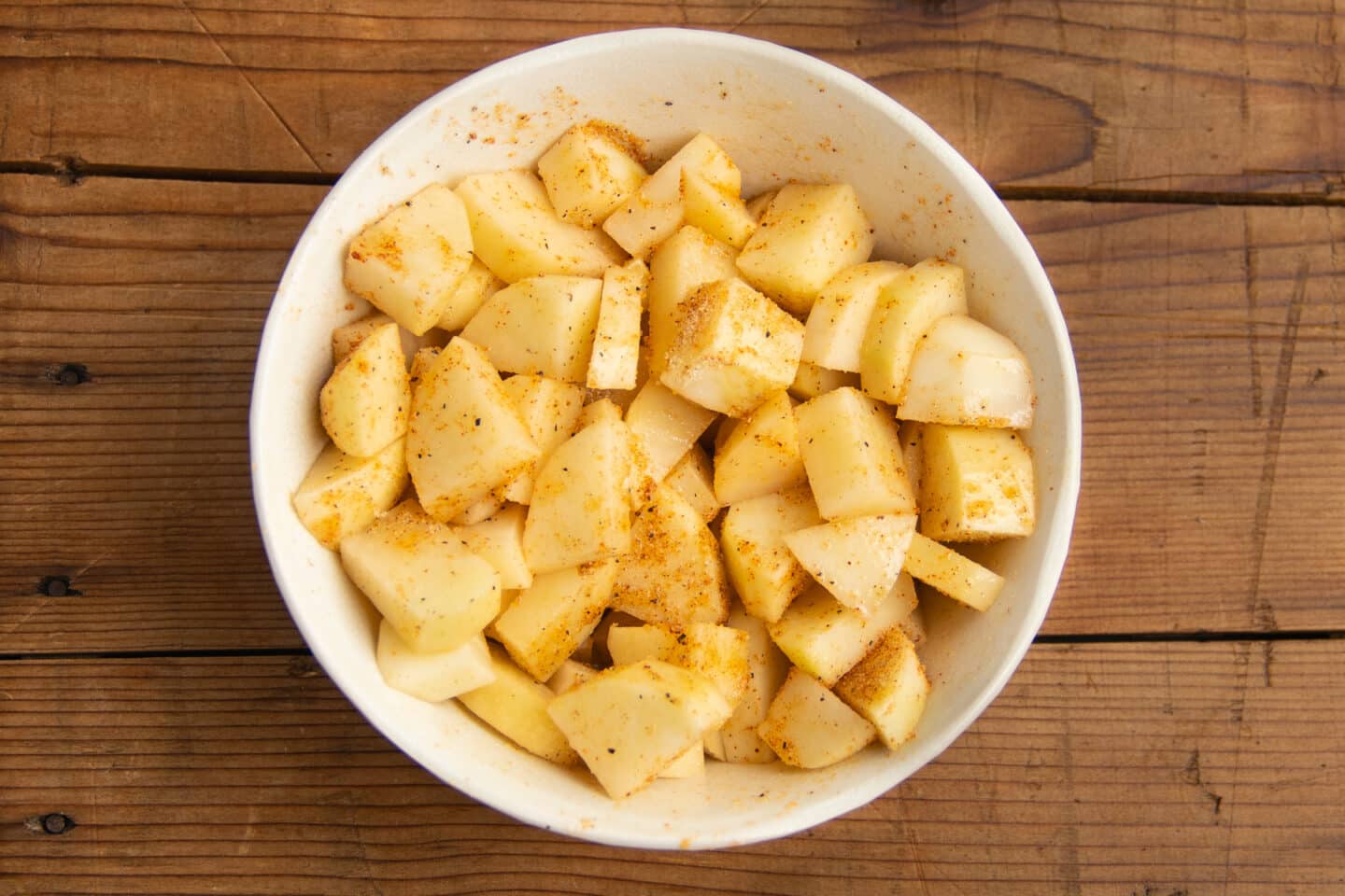 This is a photo of the potatoes seasoned with spices. 