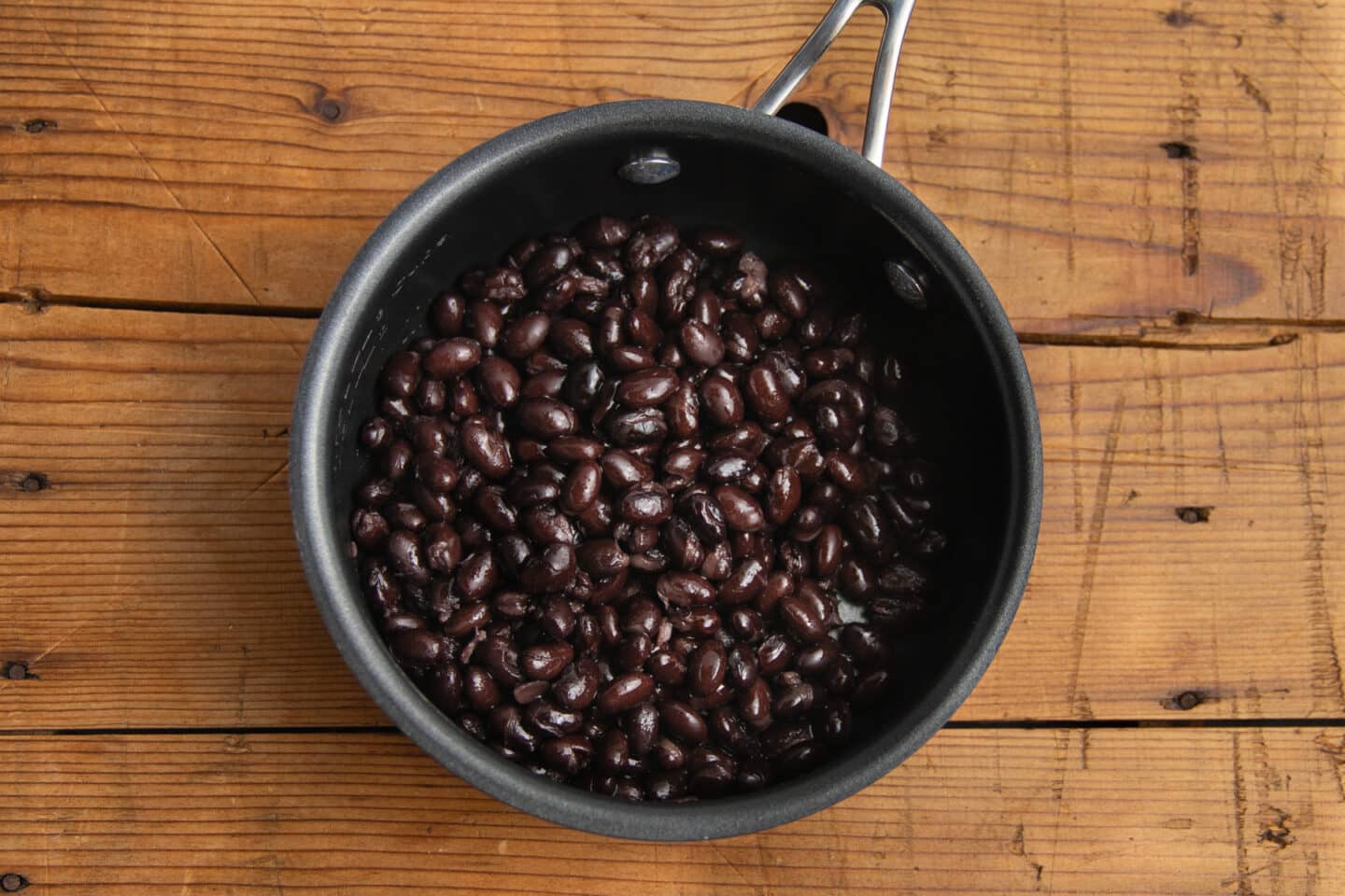 This is a picture of black beans in a pot. 