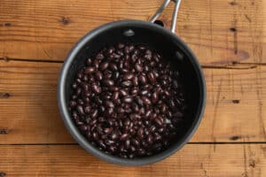 This is a picture of black beans in a pot.