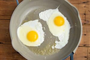 This is a picture of sunny side up eggs in a skillet.