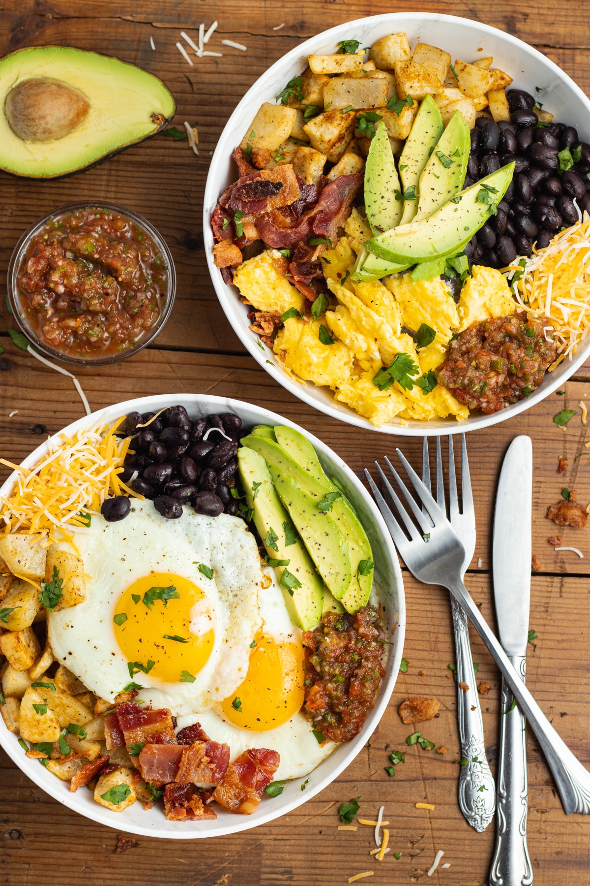 This is a picture of two filled burrito breakfast bowls.